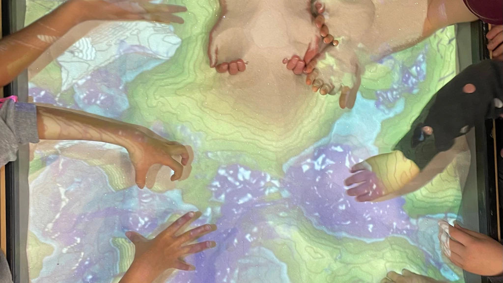 Many excited hands in the interactive Sandbox